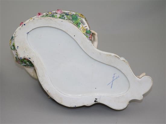 A pair of English porcelain figural sweetmeat dishes, mid 19th century, after the Meissen originals, length 29cm, restorations